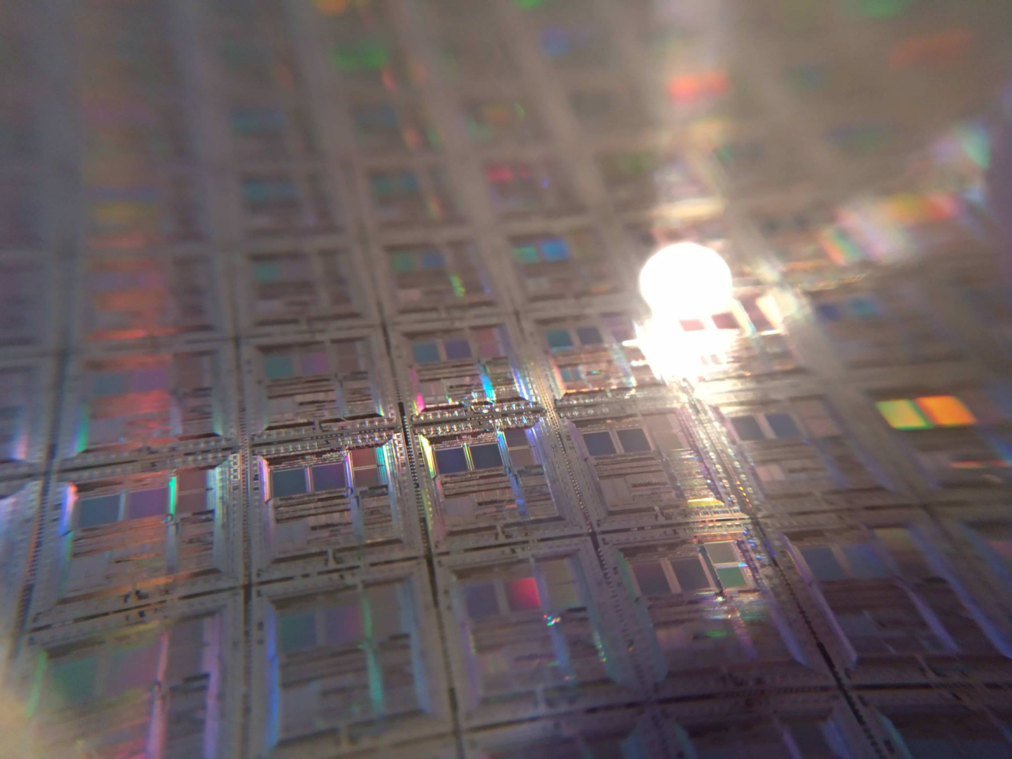 Close-up of patterned dies on a silicon wafer before dicing